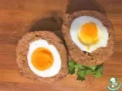 Яйца по-шотландски с ветчиной и анчоусами